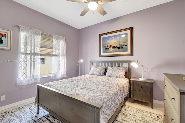 bedroom with light tile patterned floors and ceiling fan