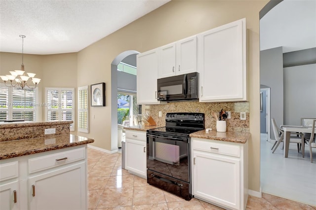 kitchen featuring white cabinetry, black appliances, and stone countertops