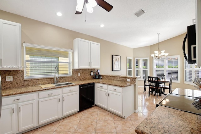 kitchen featuring pendant lighting, sink, white cabinetry, black appliances, and kitchen peninsula