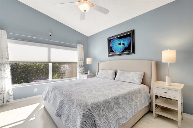 bedroom featuring lofted ceiling and ceiling fan