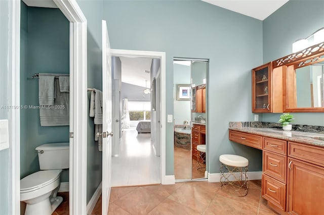 bathroom featuring tile patterned floors, toilet, and vanity