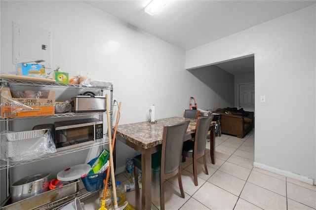 dining area with light tile patterned floors