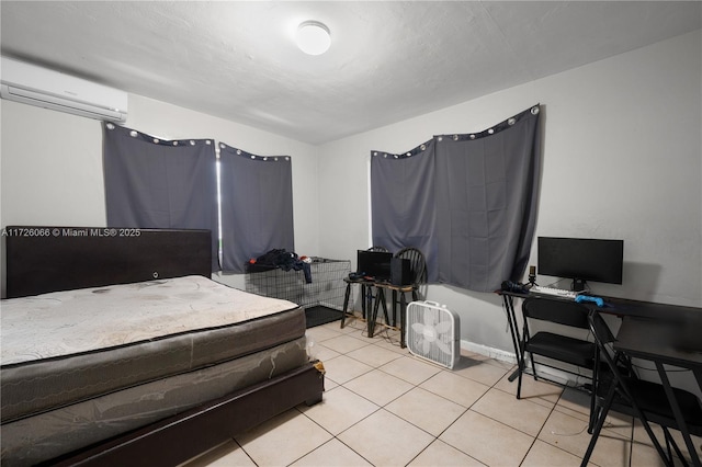 tiled bedroom featuring a wall mounted air conditioner