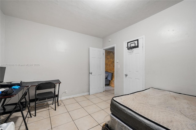 bedroom featuring light tile patterned floors