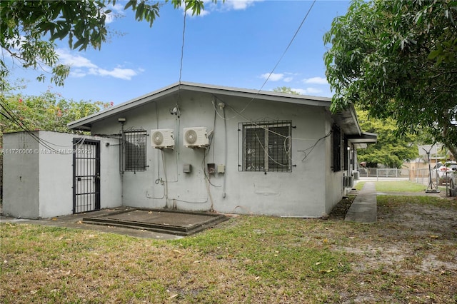 back of house with a yard