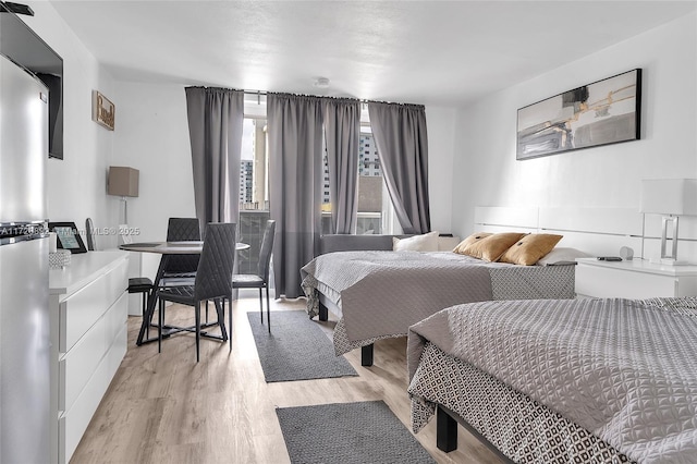 bedroom with light wood-type flooring