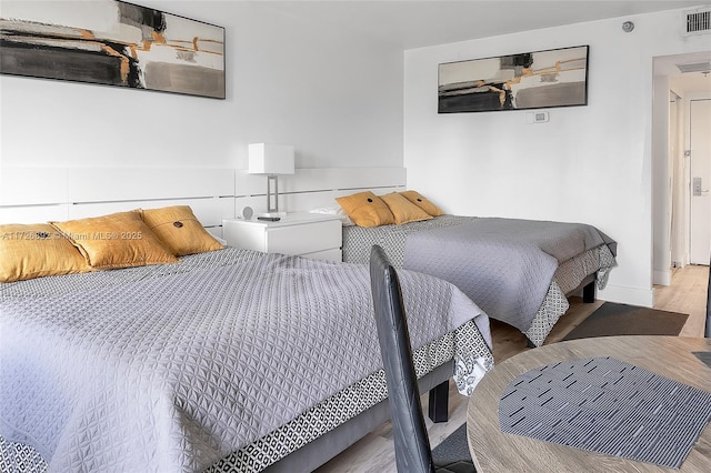 bedroom with light hardwood / wood-style floors