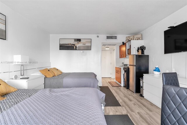 kitchen featuring sink, white appliances, and dark hardwood / wood-style floors