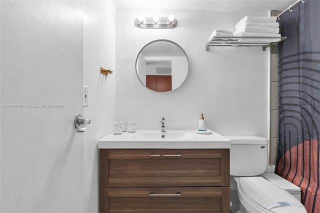 bathroom with vanity and toilet