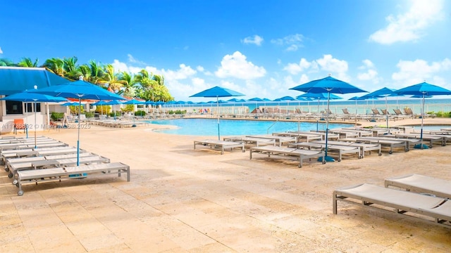 view of swimming pool with a water view