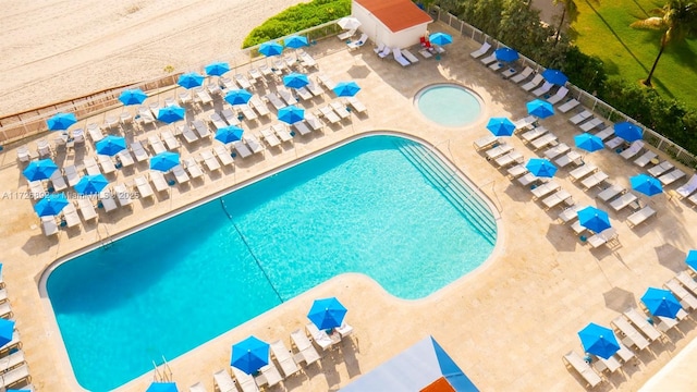 view of swimming pool with a patio