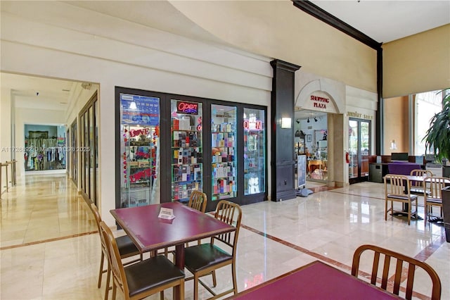 dining room with a high ceiling