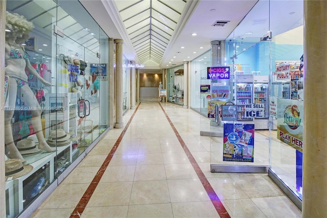 hall with tile patterned floors