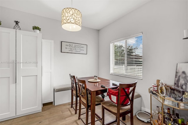 dining space featuring light wood-type flooring