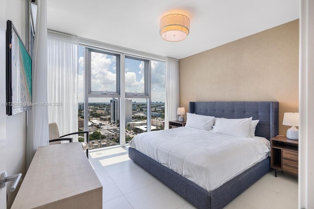 tiled bedroom with floor to ceiling windows