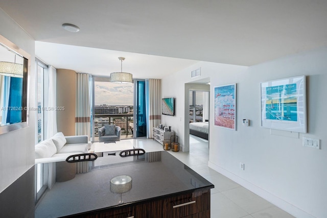 dining space with light tile patterned floors