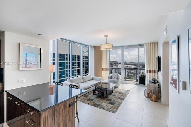 tiled living room featuring expansive windows