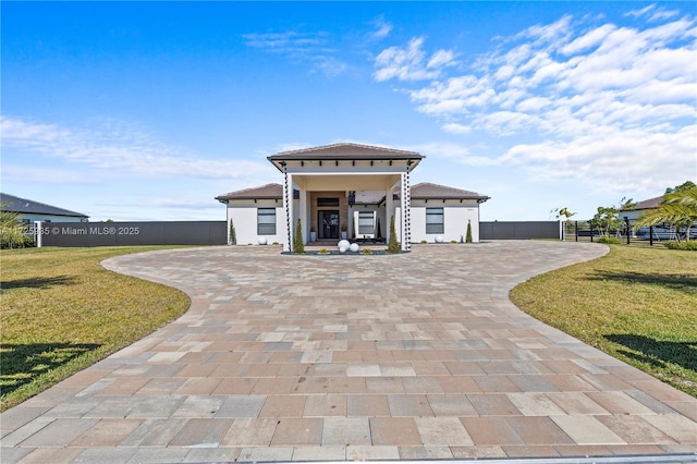 view of front of property with a front lawn