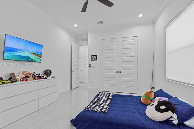 bedroom with ceiling fan, a closet, crown molding, and multiple windows