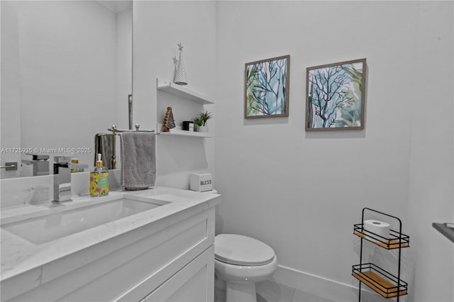 bathroom featuring tile patterned floors, vanity, and toilet