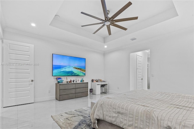 bedroom featuring a raised ceiling, ceiling fan, and ornamental molding