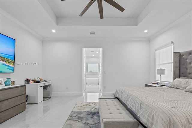 bedroom featuring ceiling fan, crown molding, connected bathroom, and a raised ceiling