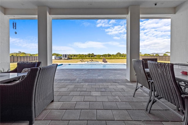 view of patio / terrace with a fenced in pool