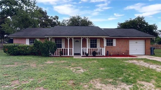 single story home with a front lawn, covered porch, and a garage