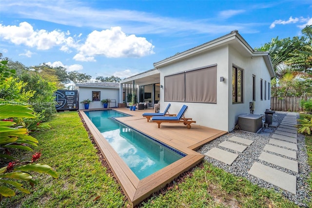 back of house featuring a pool side deck