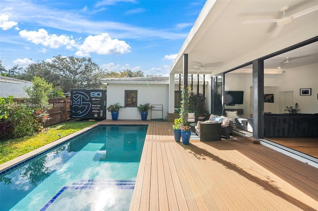 view of swimming pool featuring ceiling fan and an outdoor living space