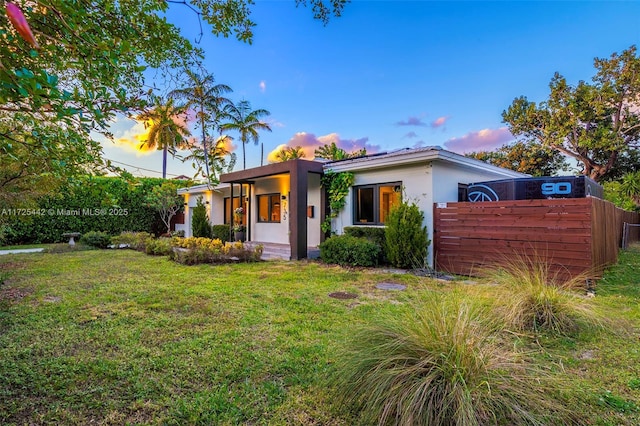 view of front of house with a yard