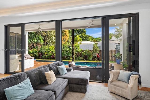 doorway to outside with ceiling fan and hardwood / wood-style floors