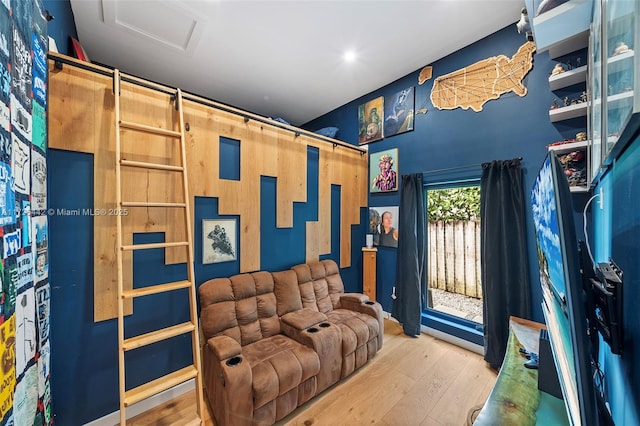 home theater room featuring hardwood / wood-style floors