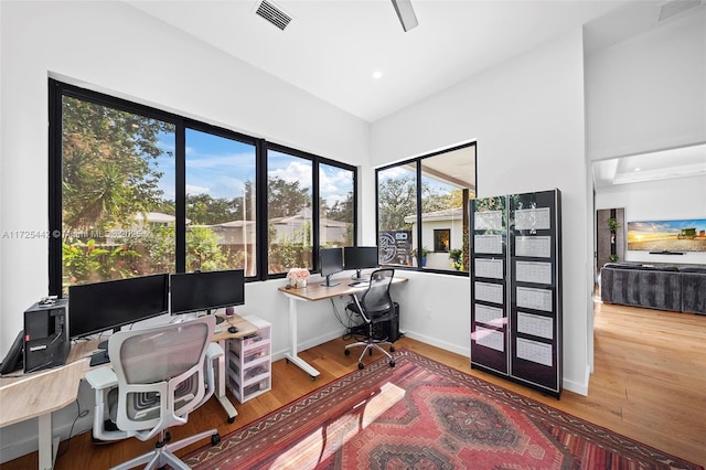 office featuring hardwood / wood-style flooring and french doors