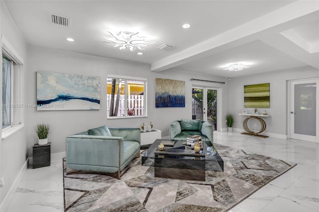 living room featuring beam ceiling and french doors