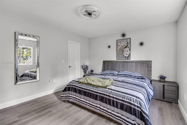 bedroom with wood-type flooring