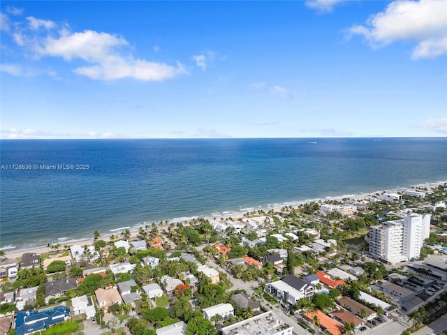 aerial view with a water view and a view of the beach