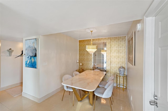 dining area featuring tile patterned flooring and a chandelier