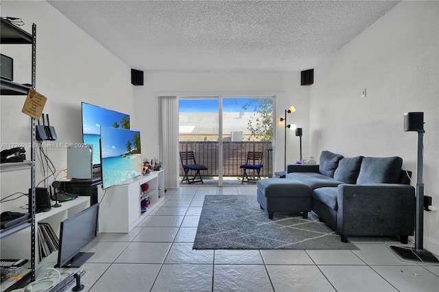 living room featuring a textured ceiling and light tile patterned flooring