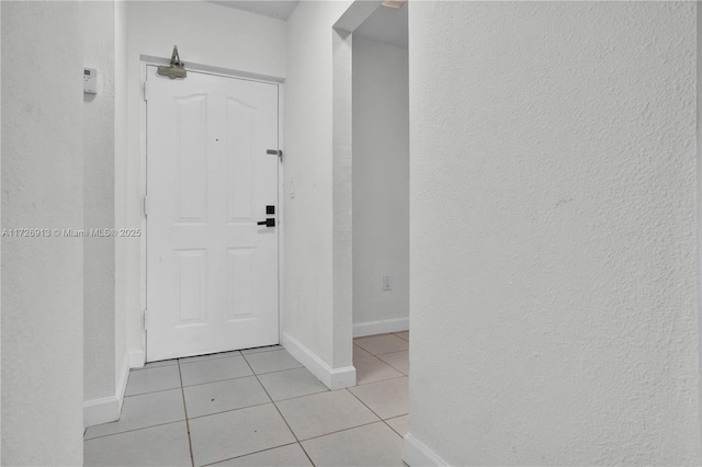 interior space featuring light tile patterned floors