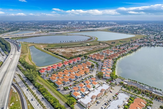 birds eye view of property featuring a water view