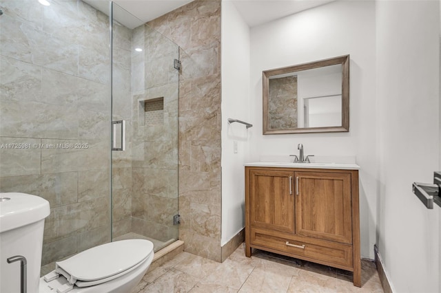 bathroom featuring toilet, walk in shower, and vanity