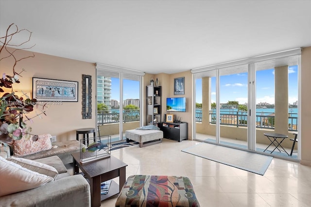 tiled living room featuring floor to ceiling windows