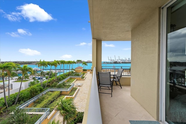 balcony featuring a water view