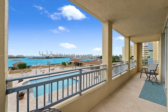 balcony featuring a water view