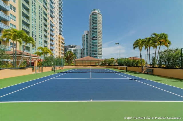 view of sport court with basketball hoop