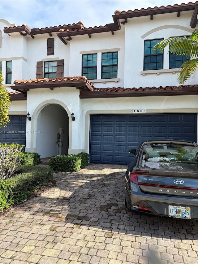 mediterranean / spanish-style house featuring a garage