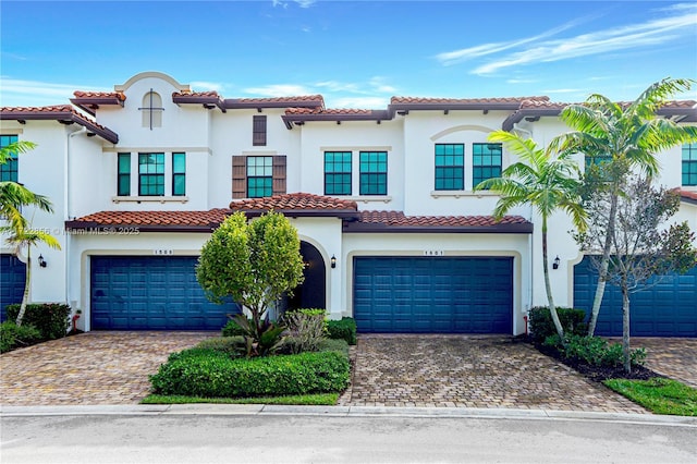 mediterranean / spanish-style house featuring a garage