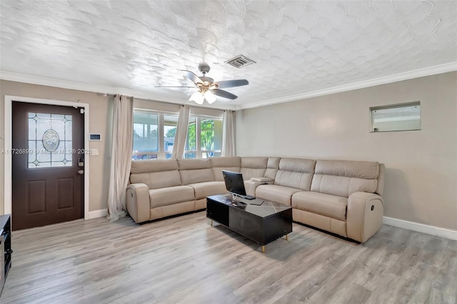 living room featuring ceiling fan, crown molding, a textured ceiling, and light hardwood / wood-style floors