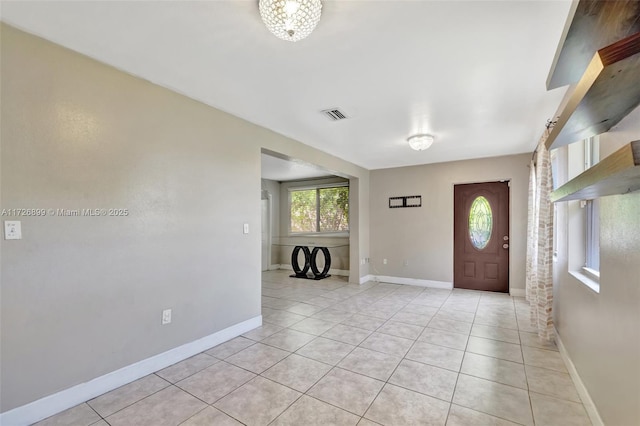 foyer featuring light tile patterned floors